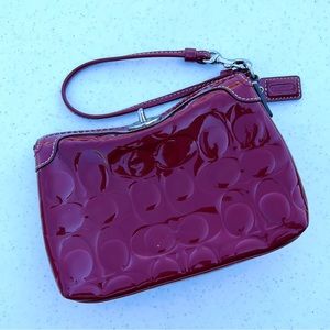 COACH patent leather red wristlet
